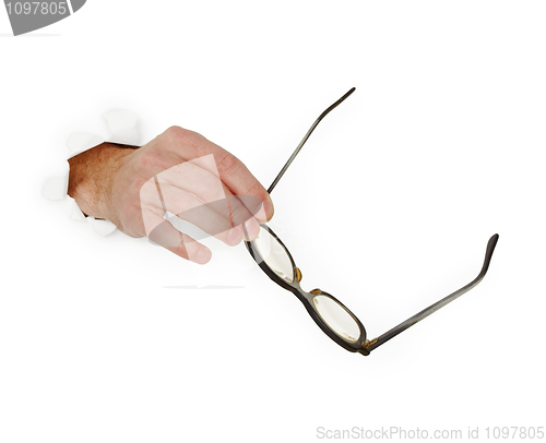 Image of Hand holds glasse on white background