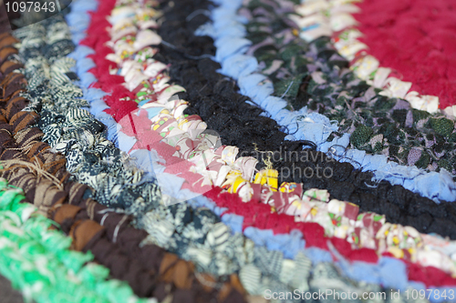 Image of Vintage homemade colorful mat closeup