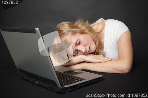 Image of Woman tired from work in internet and went to sleep