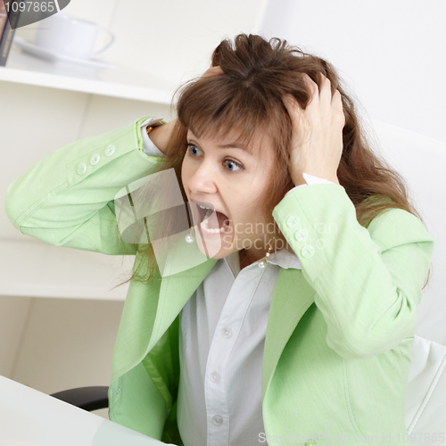 Image of Frightened business woman loudly shouts