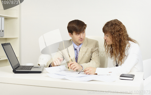 Image of Young businessmen on a workplace  in office