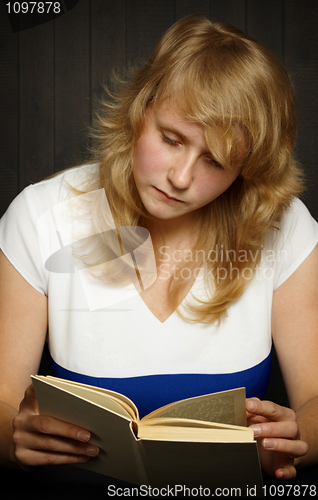 Image of Young girl reading a book