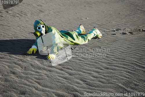 Image of Man in gas masks crawling on poisoned soil