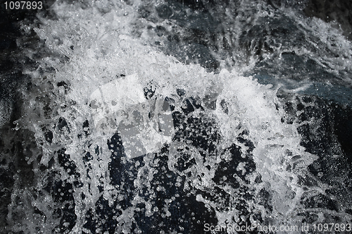 Image of Turbulent flows of water with splashes and bubbles