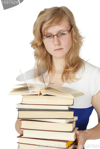 Image of Female student with pile of books isolated on white