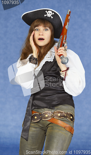 Image of Scared woman - sea pirate on blue background with pistol