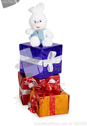 Image of Toy rabbit, and Christmas gifts on white