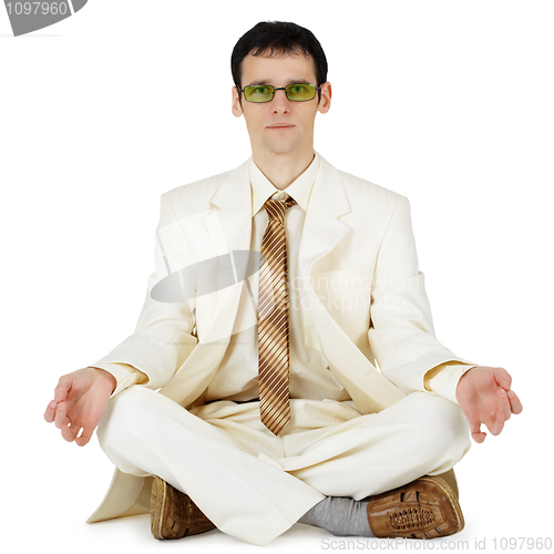 Image of Businessman in light suit - original way relaxes