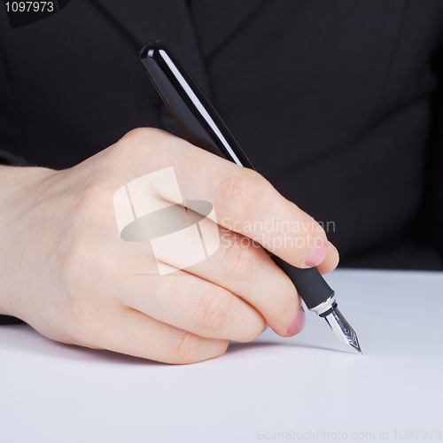 Image of Female hand holding fountain pen