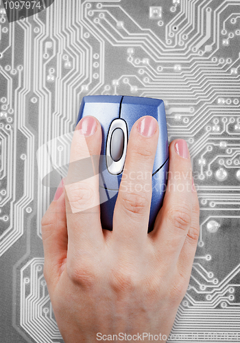 Image of Hand and computer mouse on electronic background