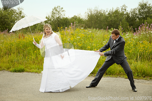 Image of Bride and groom having fun