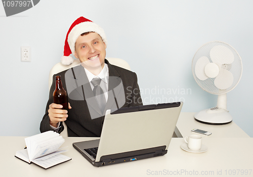 Image of Businessman gets drunk at office before new year