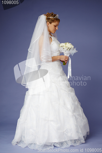 Image of Young bride in white wedding dress