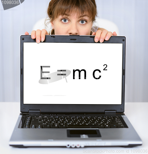 Image of Woman shows computer screen with formula