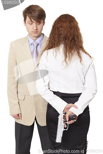 Image of Young man and the woman armed with a pistol