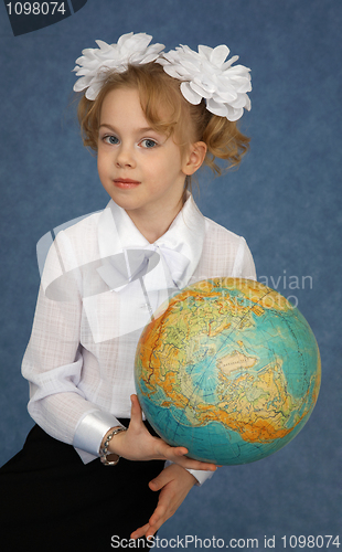 Image of Schoolgirl with geographic globe