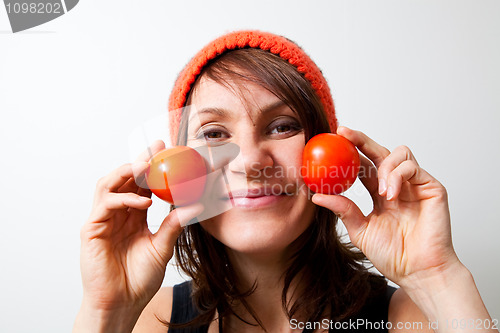 Image of Young woman with tomato cheeks