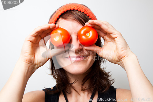 Image of Young woman with tomato eyes
