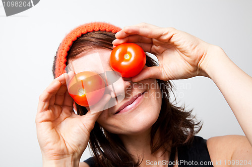 Image of Young woman with tomato eyes