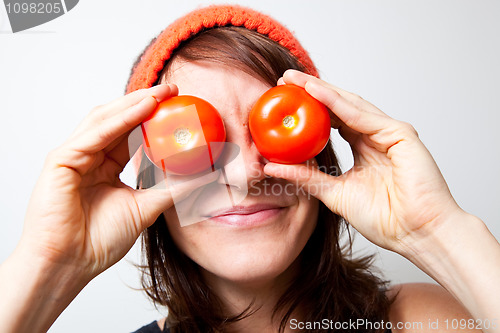 Image of Young woman with tomato eyes