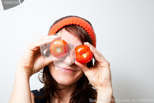 Image of Young woman with tomato eyes