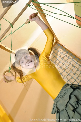 Image of child at her home sports equipment