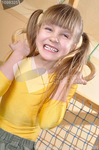 Image of child at her home sports equipment