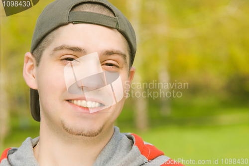 Image of Smiling Casual young male in park