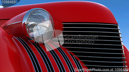 Image of Headlight and engine jacket of red retro car