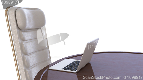 Image of Labtop on table and chair