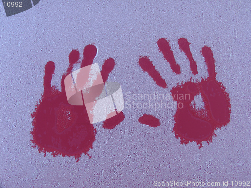 Image of Warm hands on a cold car some frosty winter morning.