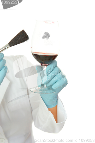 Image of Forensic scientist dusting glass fingerprints
