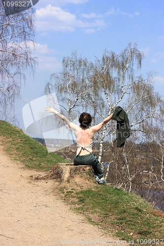 Image of The girl is pleased to spring, sunshine, warmth, the nature