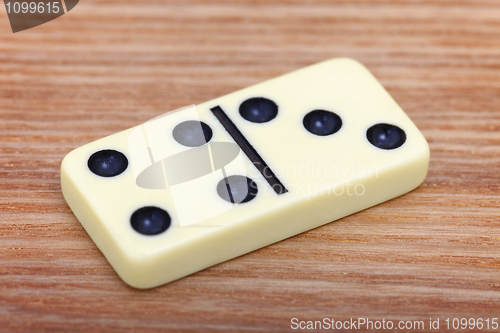 Image of Dominoes on wooden surface close up