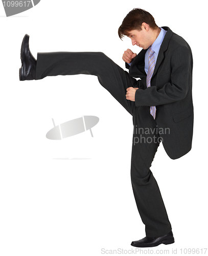 Image of Businessman kicks up on white background