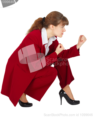 Image of Business woman sitting in combat readiness