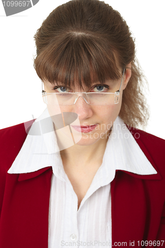 Image of Young woman looking over spectacles