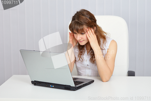 Image of A student preparing for exam with a laptop