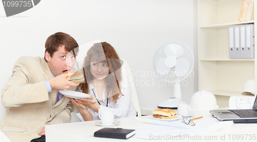 Image of Businessmen hardly waited for lunch in office