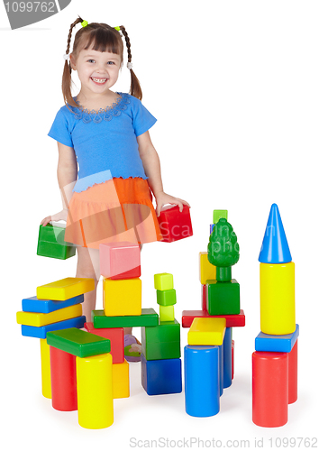 Image of Child happily playing with colored blocks