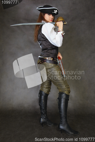 Image of Woman dressed as pirate on black with sword
