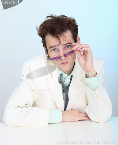 Image of Funny disheveled young man in glasses