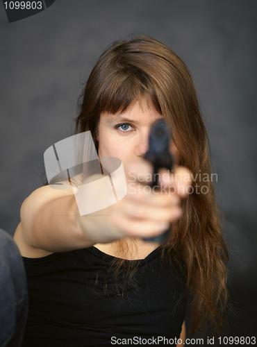 Image of Woman aiming in enemy from pistol