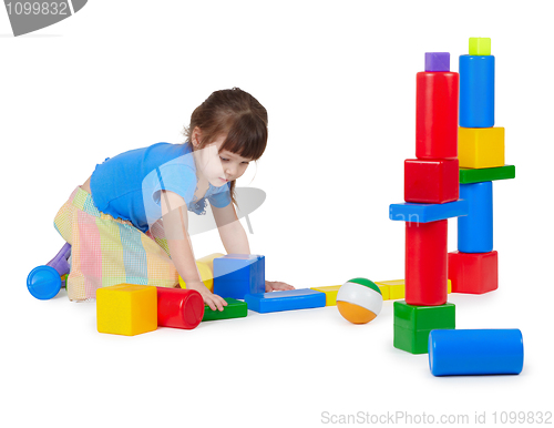 Image of Girl playing toy bricks