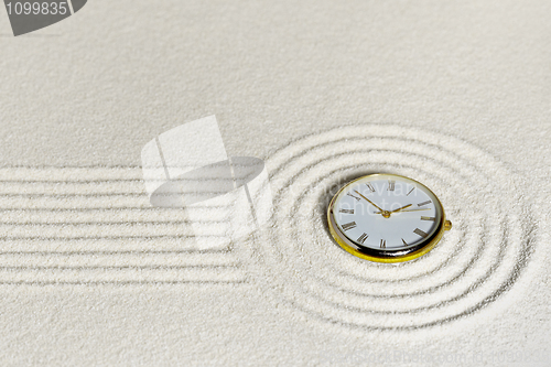 Image of Surrealistic composition with watch on sand