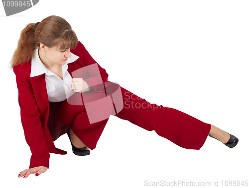 Image of Woman in business suit kicks