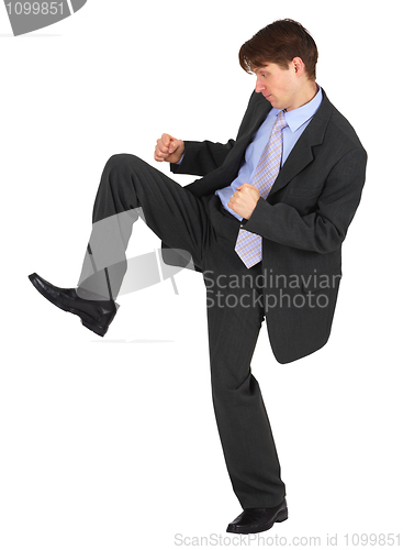 Image of Businessman kicks down on white background