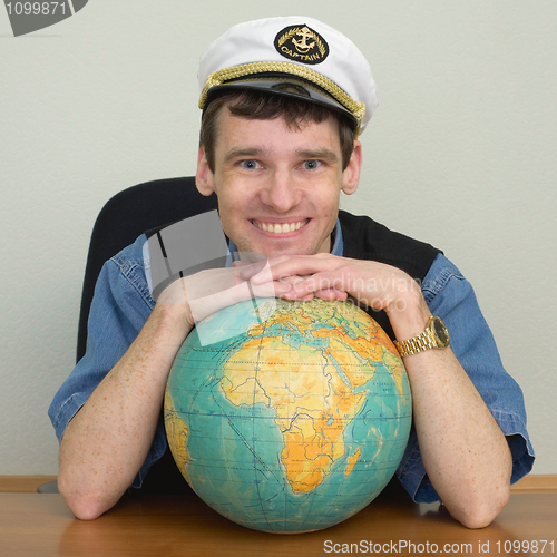 Image of Young smiling guy in cap