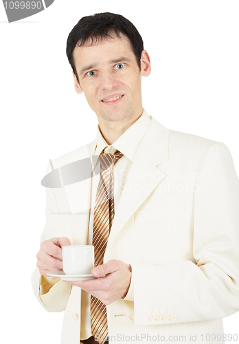 Image of Young business man with cup of tea
