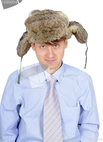 Image of Portrait of young man in fur hat isolated on white background
